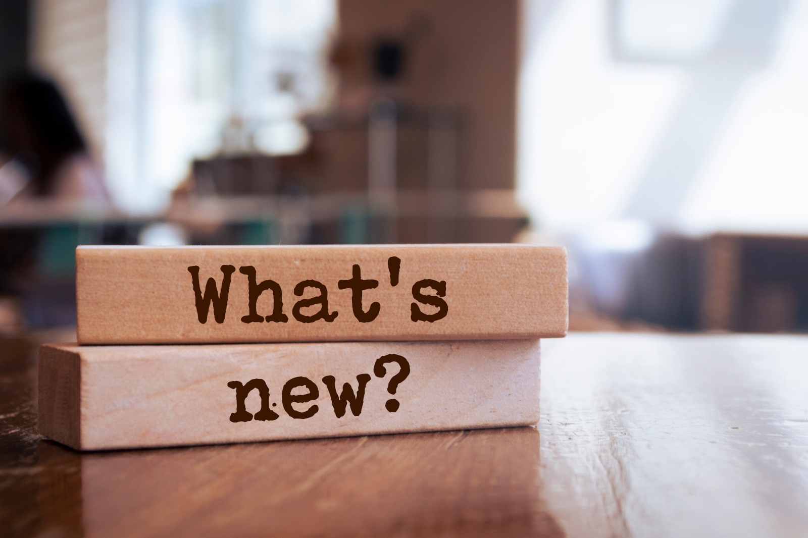 Concept image: wooden blocks with the words “What's new” representing a new HTML feature for the NestForms offline survey app