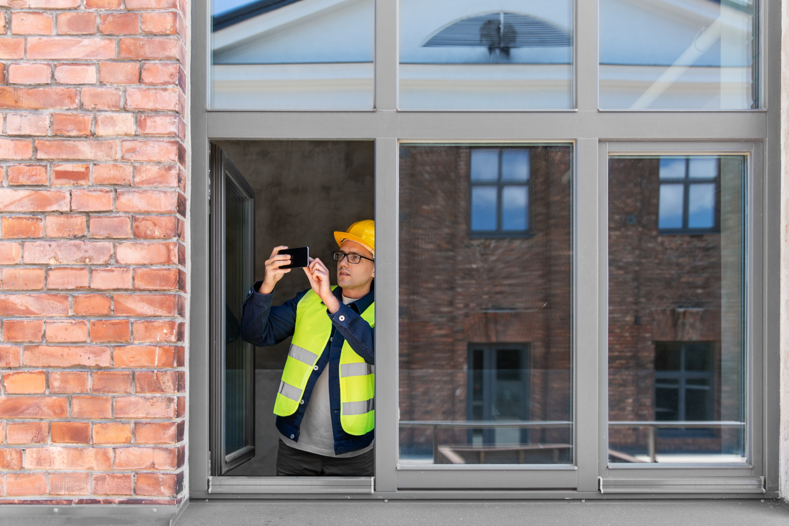 Construction worker carrying out final inspection checklist: Taking an image of frames using the NestForms Punch List App