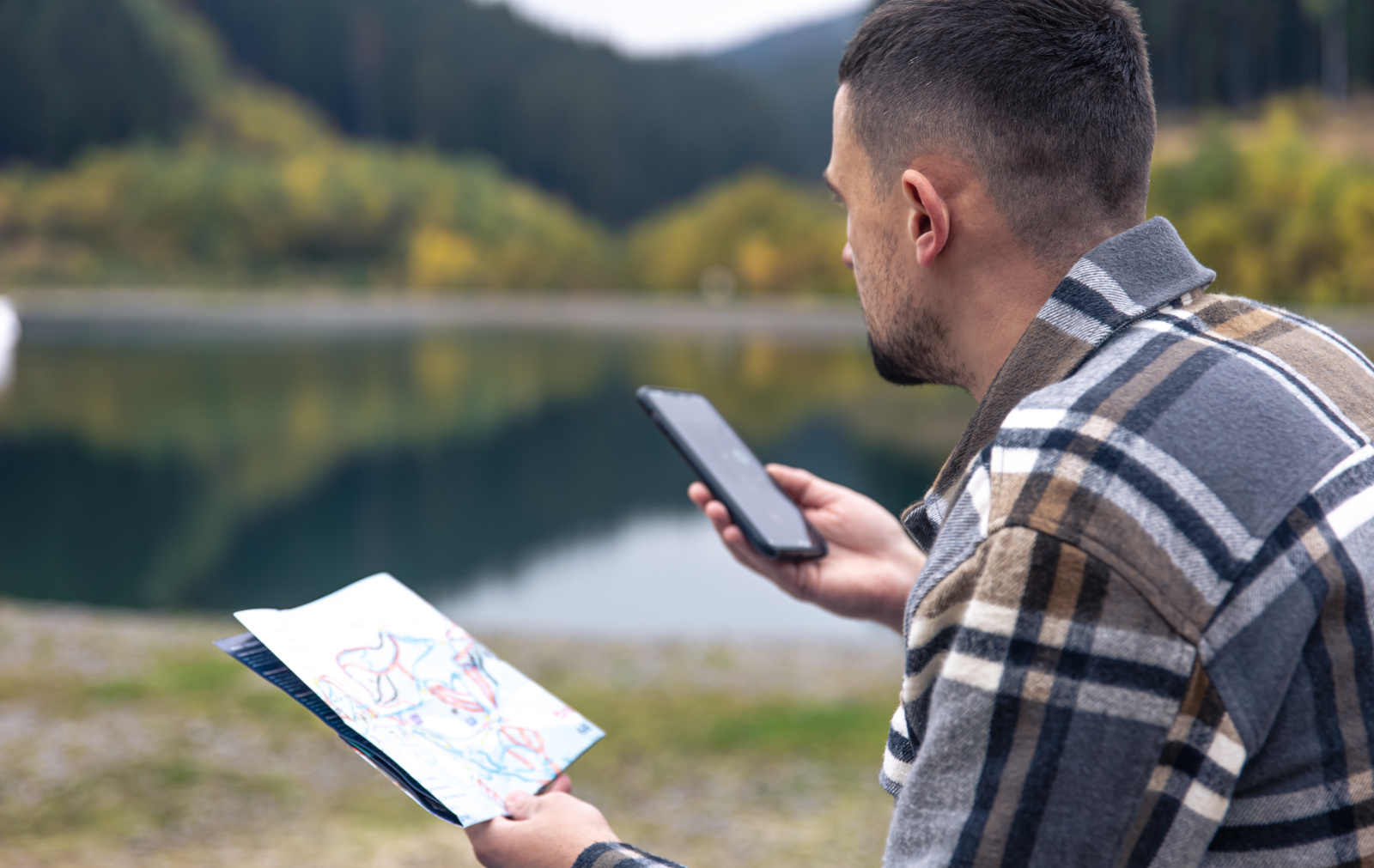 Land surveyor making a voice recording on smart phone at potential work site: Audio transcription withNestForms offline surveys