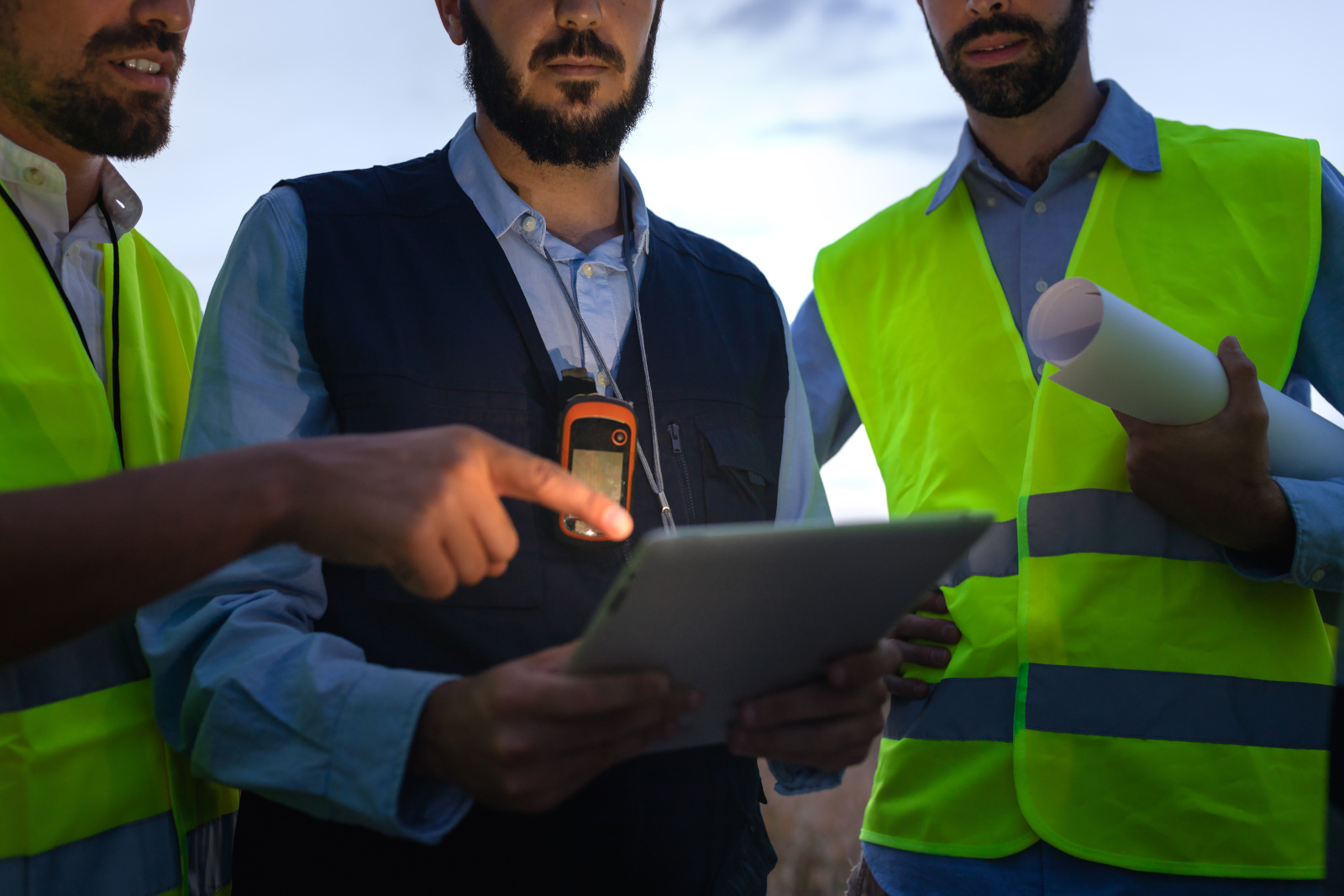 Engineer and construction workers with smart device: the NestForms Mobile Data Collection App