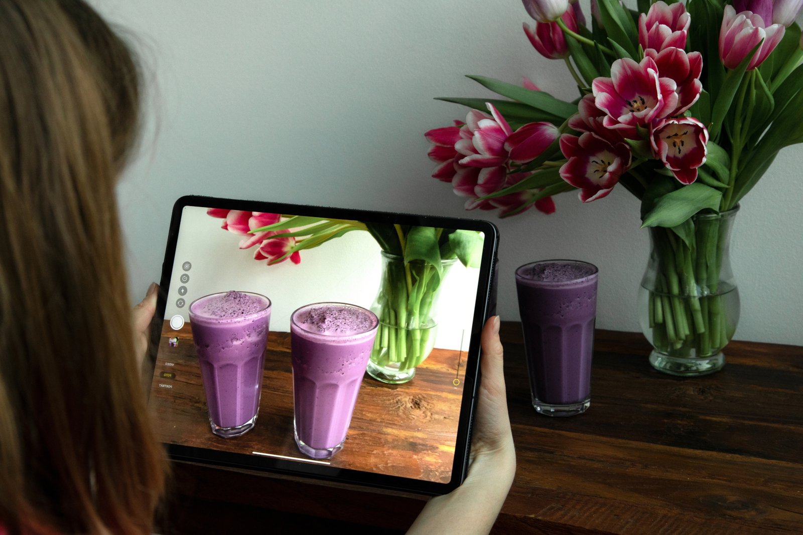Event organiser taking image of two blueberry shakes as part of a promotion campaign: The NestForms Offline Survey App