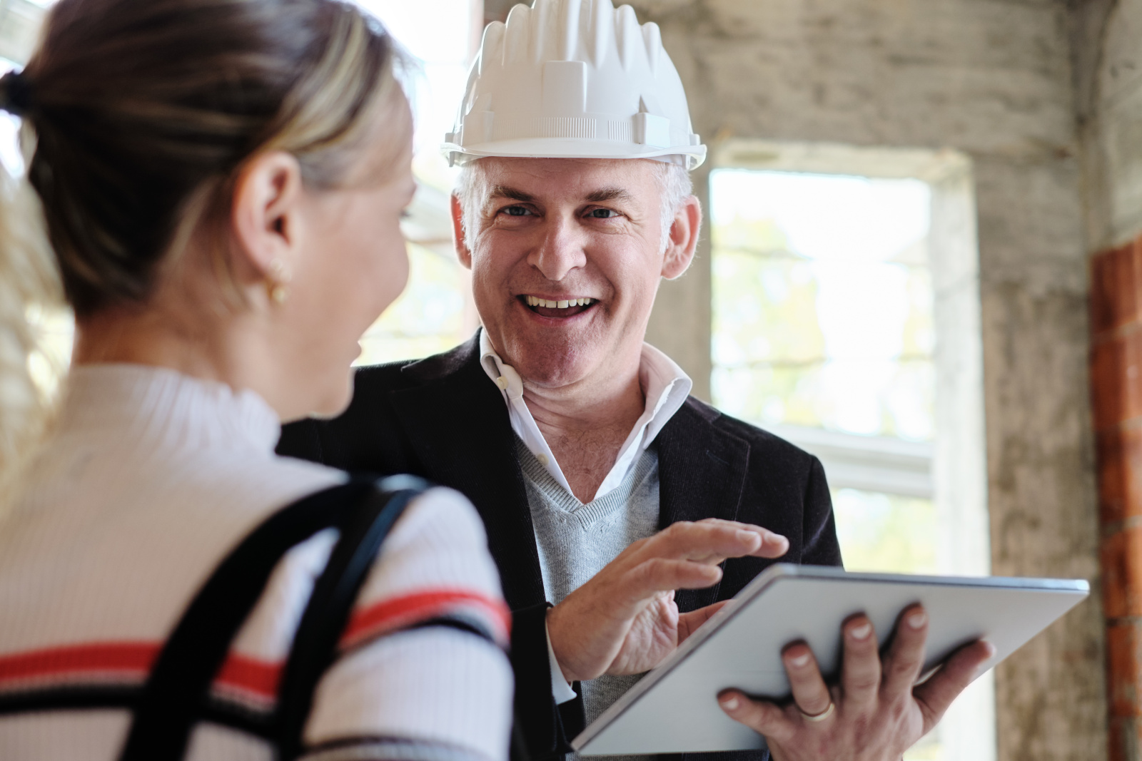 Building manager discussing project handover to client: Project Handover Checklists with NestForms offline surveys