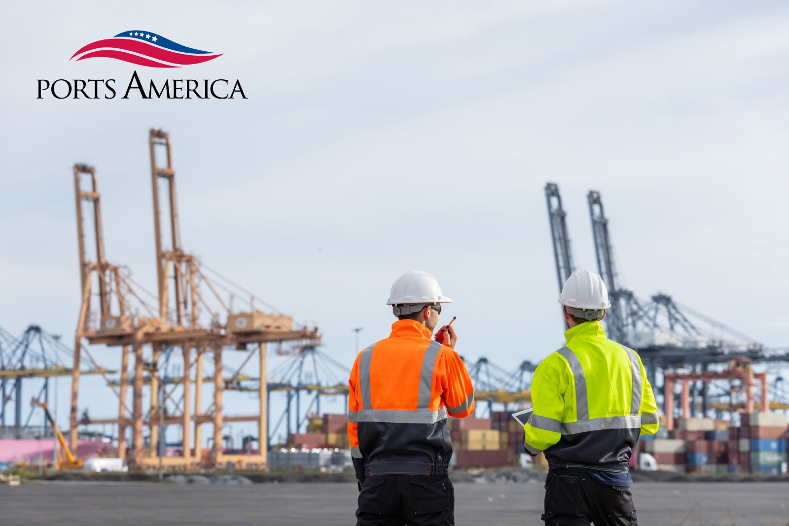Two field officers with tablet working at Port location, cargo unloading in the background: NestForms offline surveys