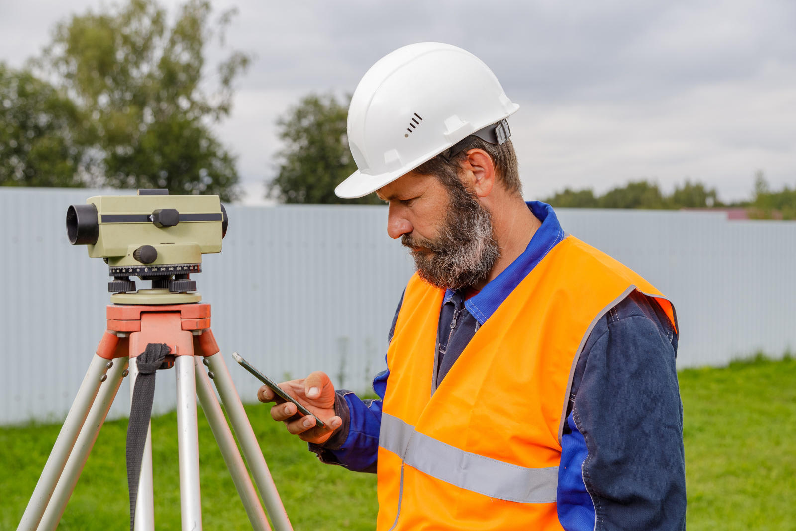 Land Surveyor Using the NestForms App in the field